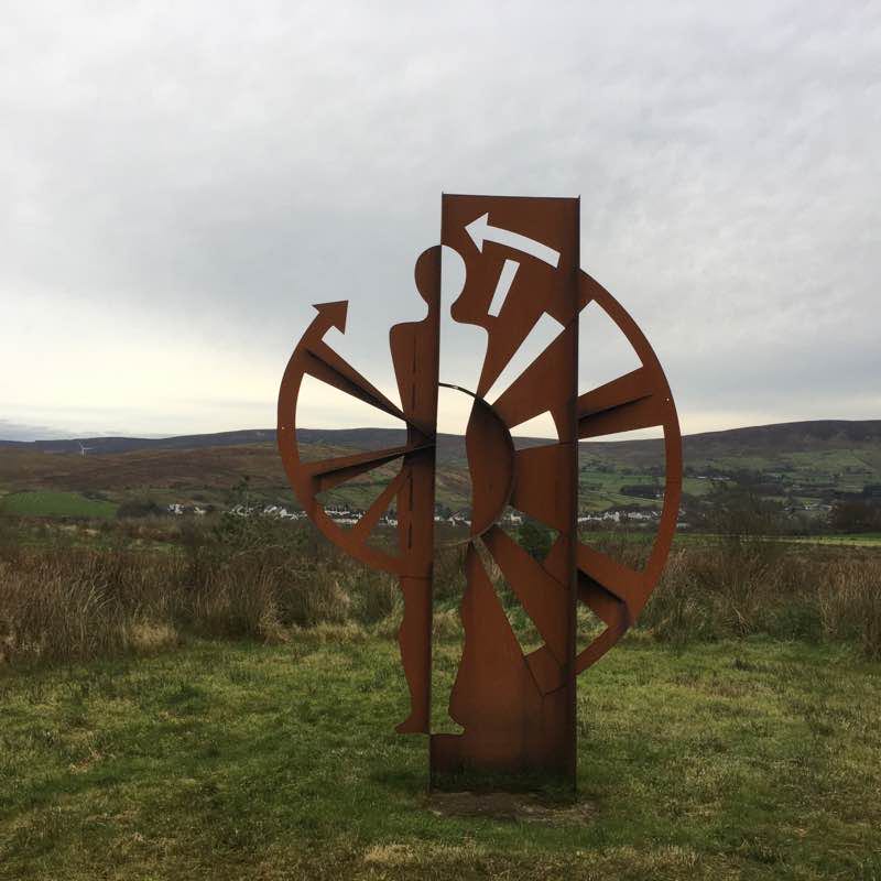Metal Statue in field walking route map in Glenariffe